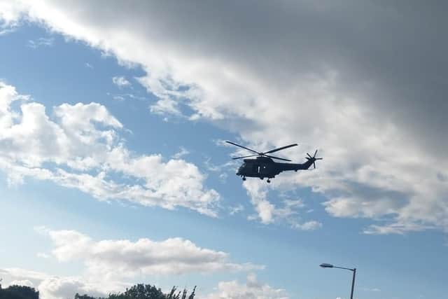 Photos taken by reader Tony Carter showthe helicopters hovering above Temple Park.