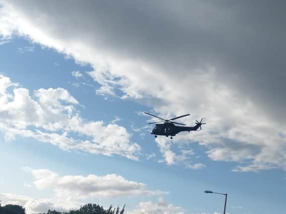 Photos taken by reader Tony Carter showthe helicopters hovering above Temple Park.