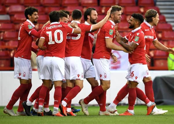 Forest striker Daryl Murphy is congratulated after opening the scoring