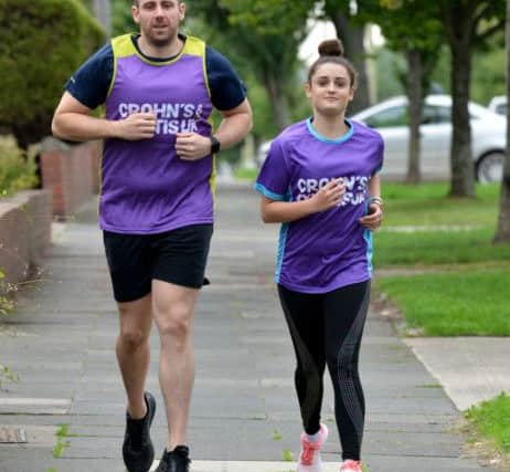 Eli Jo House who is taking part in the Jnr Great North run in memory of her dad Matt Fryer photographed with her God Father James Knox who is running in the Great North Run. Picture by FRANK REID