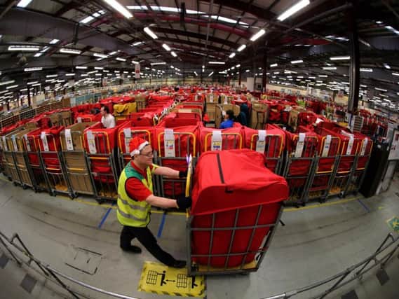 Royal Mail is recruiting seasonal staff to help sort the Christmas post. Pic: Andrew Milligan/PA Wire.