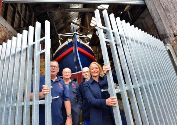 New shutters and gate at The North East Maritime Trust donated by Solar Solve Marine. From left Trust's secretary Jerry Dubman and Dave Parker with Solar Solve Ian Ratcliffe and MD Julie Lightfoot MBE