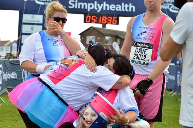 An emotional moment for parents Caroline Curry, left, and Lisa Rutherford, after they cross the finish line of the Great North Run 2018, which they did in aid of the Chloe and Liam Together Forever Trust.