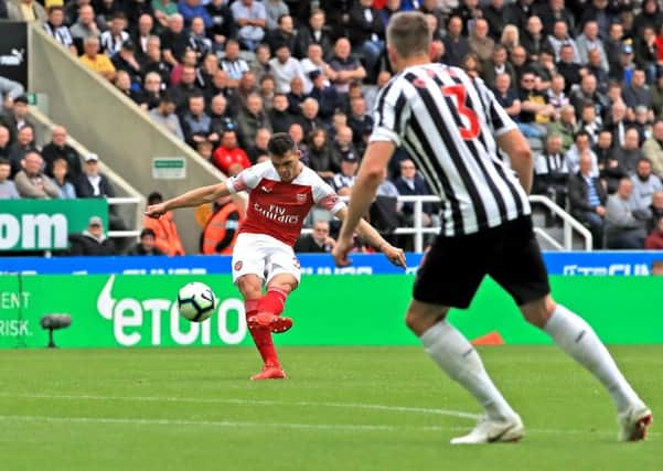 Arsenal's Granit Xhaka scores his side's first goal of the game at St James's Park.