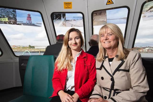 Photographer Jay Smith with ferry manager Carol Timlin.