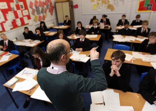 A teacher during a lesson of secondary school pupils. Picture by PA Wire/PA Images