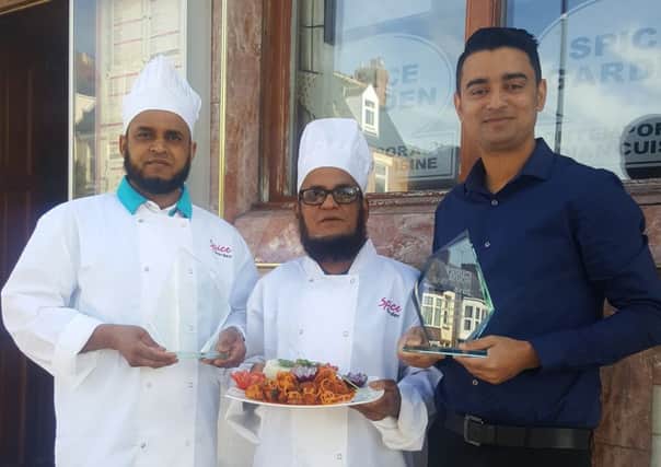 Spice Garden chefs Akkas Miah and Md Ful Miah with manager Rukon Chowdhury.