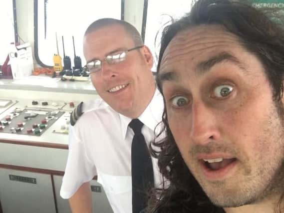 Comedian Ross Noble, right, with ferry skipper Mark Elsy.