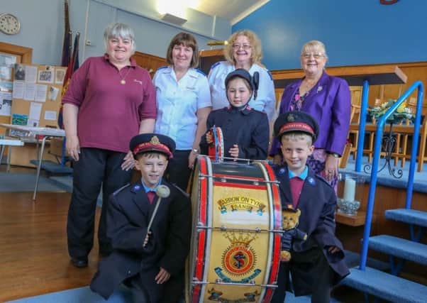 Irene Lawson, Christine Jones, Carol Hall and Councillor Fay Cunningham with local schoolchildren, Aidan McCoy, Erin Newbrook
and Ben Patterson at a celebration of 140 years of the Salvation Army in Jarrow. Picture by Tom Banks