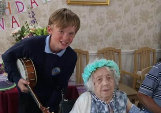 Mena with James Bassett on her 109th birthday