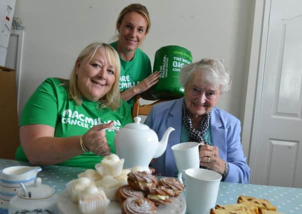 Beryl Coffey and her auntie Maisie Stewart hold an annual family Macmillan coffee morning. Back, Macmilland fundraiser Jane Curry