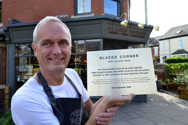 Head Chef at Blacks Corner John Craig with the brass plaque, which will be installed today.