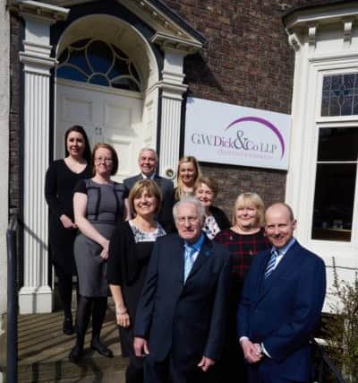 (Front L-R) Founding partner Bill  Dick with son and managing partner Andrew Dick, along with their dedicated team of staff.