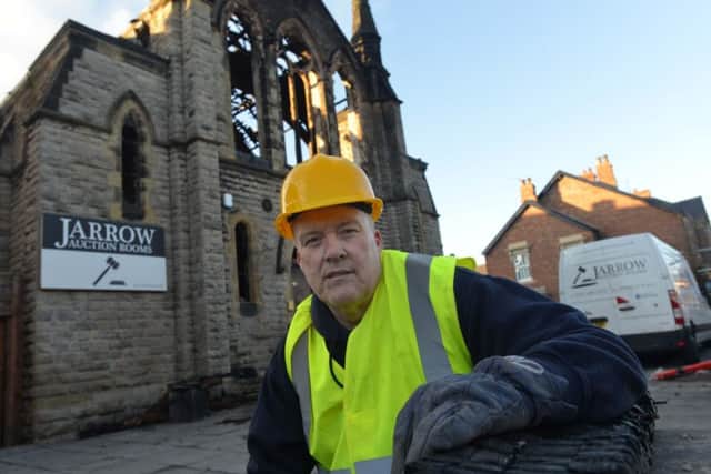 Jarrow Auction Rooms owner Brian Cairns outside the building following the blaze last year.