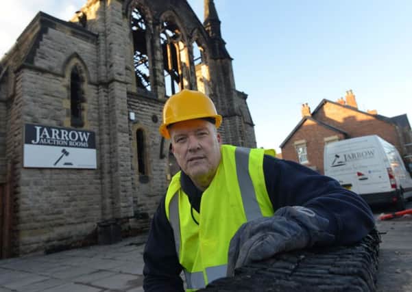 Jarrow Auction Rooms owner Brian Cairns outside the building following the blaze last year.