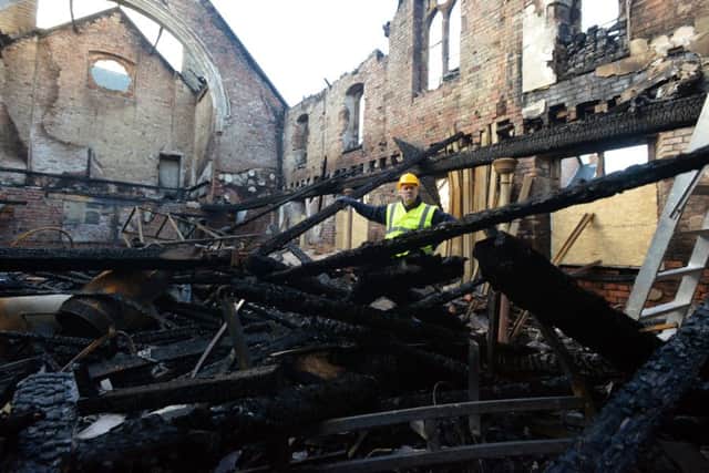 Owner Brian Cairns inside the Jarrow Auction Rooms building following the fire.