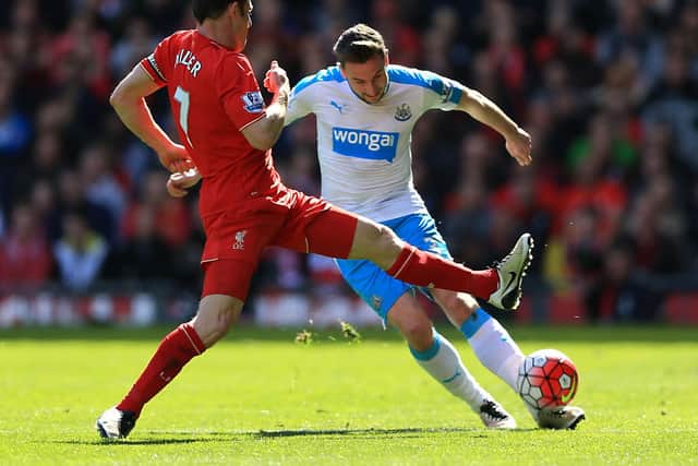Paul Dummett competes against former Newcastle midfielder James Milner