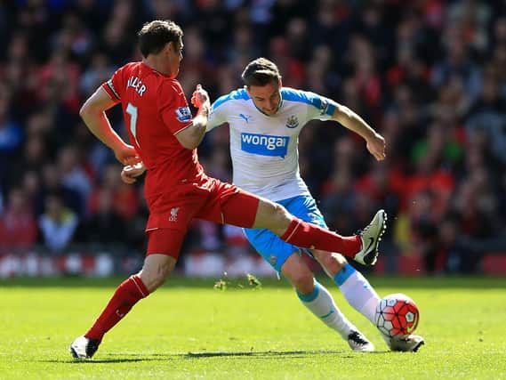 Paul Dummett competes against former Newcastle midfielder James Milner