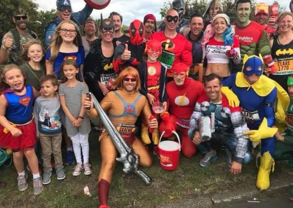 People taking part in the Strongarm Challenge in memory of Peter Metcalfe after completing the Great North Run.