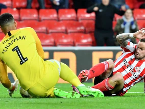 Chris Maguire challenges for the ball.