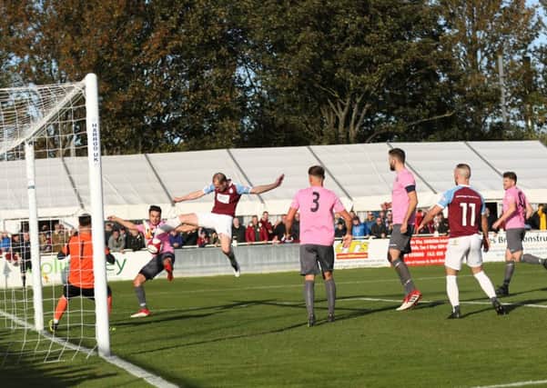 Gary Brown scores to put South Shields into a commanding 3-0 lead against Grantham Town. Picture by Peter Talbot.