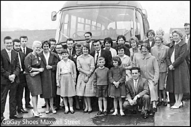 Go Gay Shoes Ltd. factory workers set off on a bus trip.
