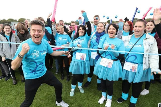 Richard McCourt gets the Memory Walk underway in Bents Park