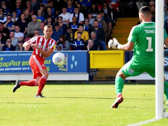 Lee Cattermole scores his second goal at AFC Wimbledon earlier this season