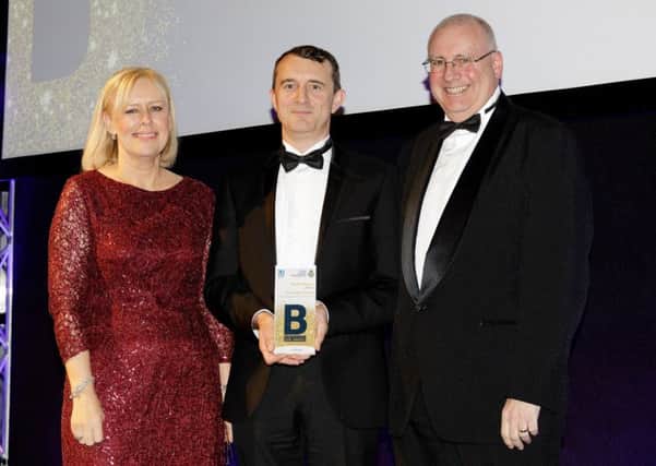 Dave Morgan, centre, with Peter Strachan, chair of the North East Ambualance Service and Nicola Richardson of awards sponsor Ward Hadaway.