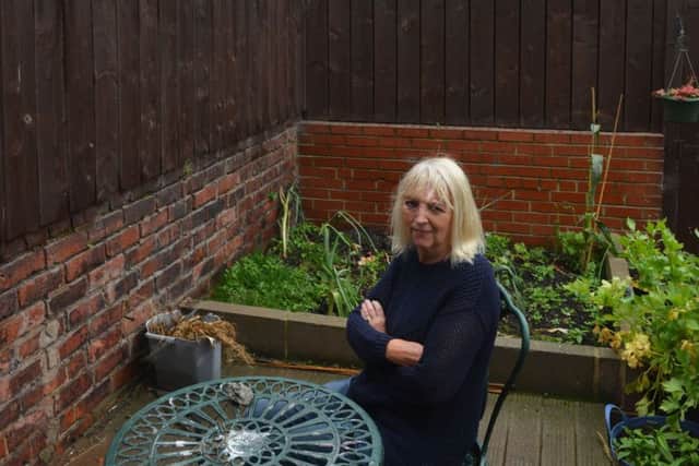 Denise says sprinklers soak her garden