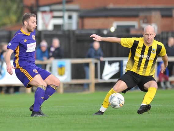 Action from the FA Vase clash between Hebburn Town (yellow and black) and City of Liverpool, which was marred by violence after the game.