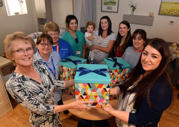 Sunderland Royal Hospital Maternity department consultant Helen Cameron, left, receives donation boxes from Steph Archbold.