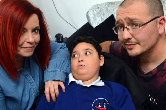 Jemma and Aaron Meek with son Callum, 10,  who has a rare genetic condition.