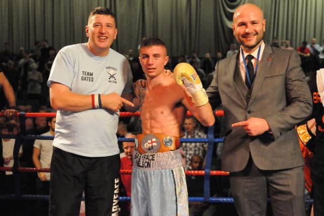 Anthony Nelson pictured with manager Mal Gates and promotor Steve Wraith after winning the English title at Temple Park Centre.