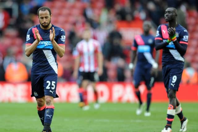 Andros Townsend and Papiss Demba Cisse applaud away fans after the loss at Southampton in 2016.