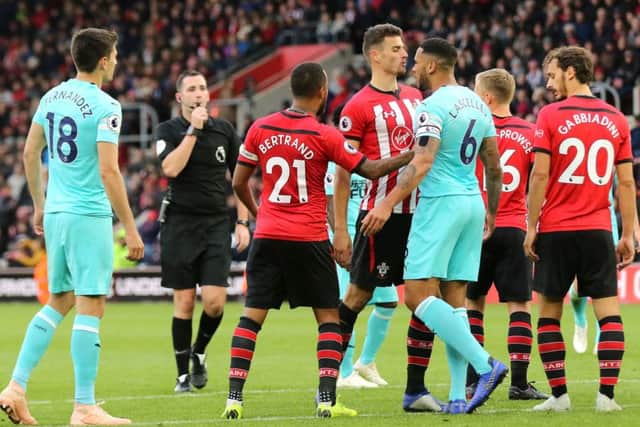 Southampton's Wesley Hoedt, left, exchanges words with Jamaal Lascelles.