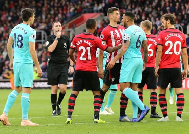 Southampton's Wesley Hoedt, left, exchanges words with Jamaal Lascelles.