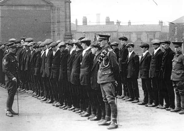 Soldiers of the regular Army drilling new recruits at the rear of the Town Hall, in Beach Road, during the First World War.