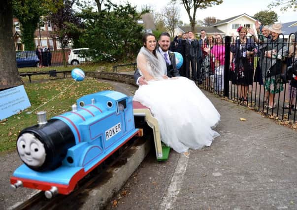 Wedding couple Chris and Rebecca Spokes on the miniature railway in Roker Park as they are waved off by their wedding guests. Picture by FRANK REID