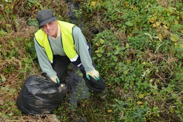 John Cook, Tyne Rivers Trust volunteer cleaning up Monkton burn. Picture by FRANK REID