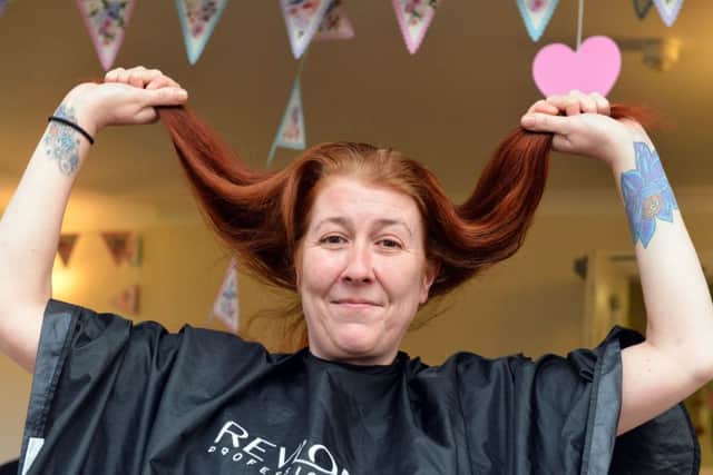Sarah Rice shows off her locks before the charity headshave.