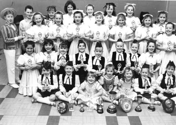 Pupils at  Valerie Shepherd School of Dancing with the trophies they won in a competition held at Hedworthfield School in 1990.