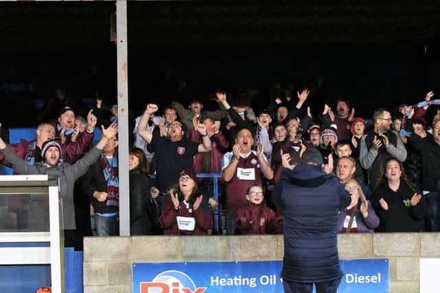 Kitman George McLaughlin celebrates with the fans after the Whitby win.