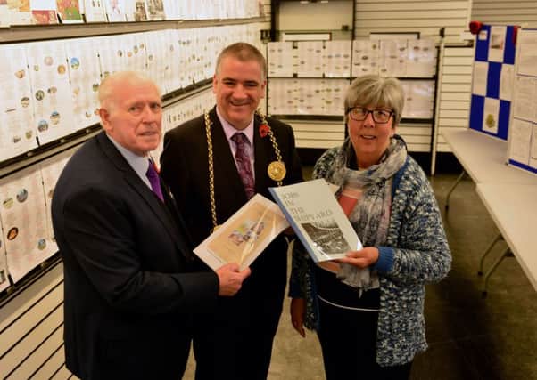 (Right) Secretary of The Jarrow and Hebburn Local History Society Win Currie along with Chairman Ken Findlay present historical WWI books to the Mayor of South Tyneside Cllr Ken Stephenson.