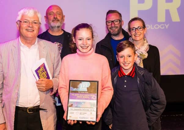 Tom Kelly, Alistair Robinson, Bo Buglass - winner of the Terry Kelly Poetry
Prize 2018 for secondary pupils -  and family. Photo by Billy Amann.
