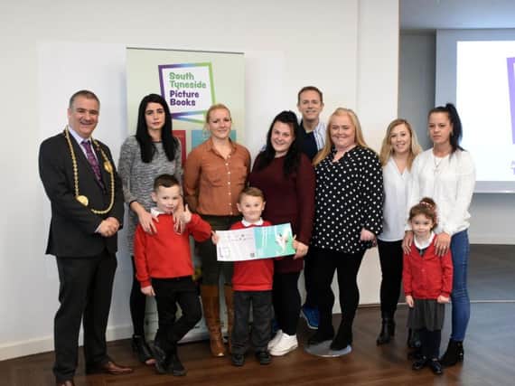 South Tyneside Mayor Coun Ken Stephenson with CBeebies star Chris Jarvis and some of the young writers, their families and teachers.