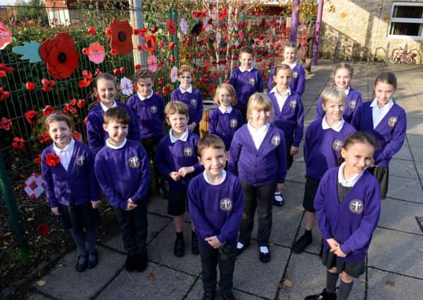 Cleadon Church of England Academy school council members alongside their WW1 Poppy display