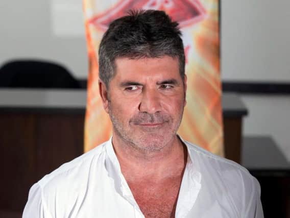 X Factor mogul Simon Cowell says he hasn't fallen out with girl group Little Mix.