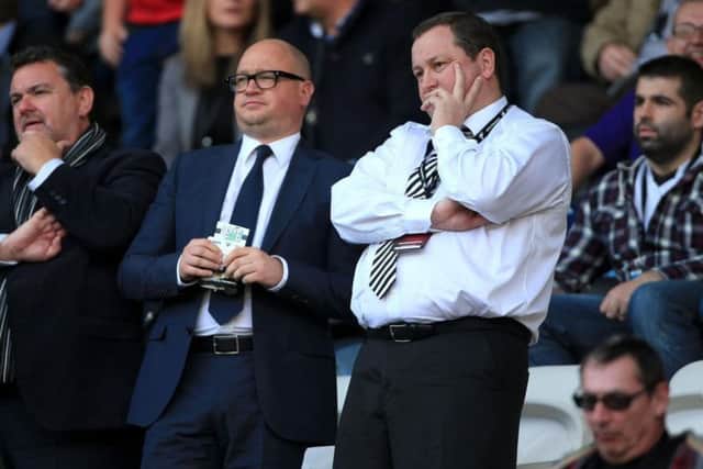 Mike Ashley flanked by Lee Charnley (left).