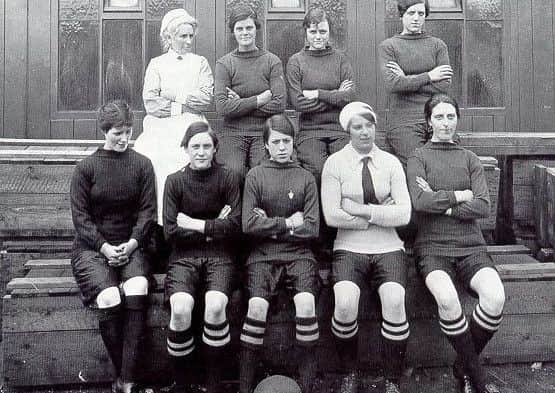 Mary Lyons, front centre, with her team